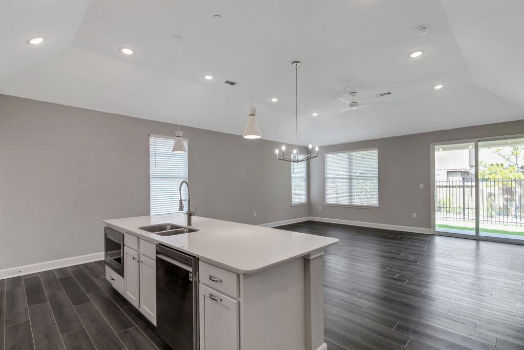 396DIHYZL0-0B9A5935 - Woodhaven Village Interior image of a resident's kitchen and living space at Woodhaven Village, a senior living community near Spring, TX.